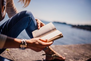 reading woman beach